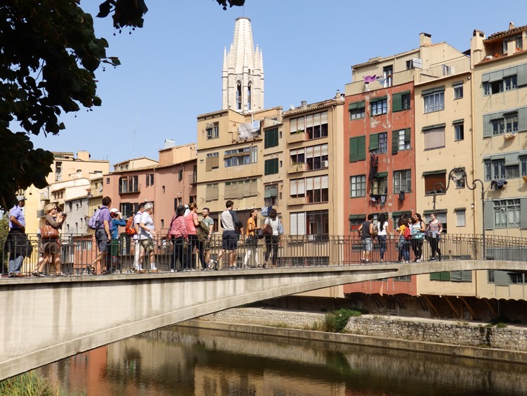 Onyar river in Girona with colourful houses and Sant Felix in the background