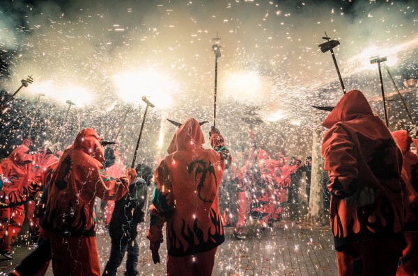 Smoke and sparkles fill the streets during a Correfoc