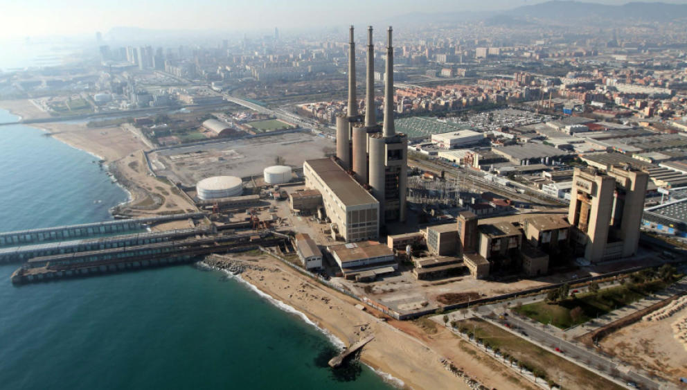 The three chimneys of the power station in Besòs in front of the beach ...